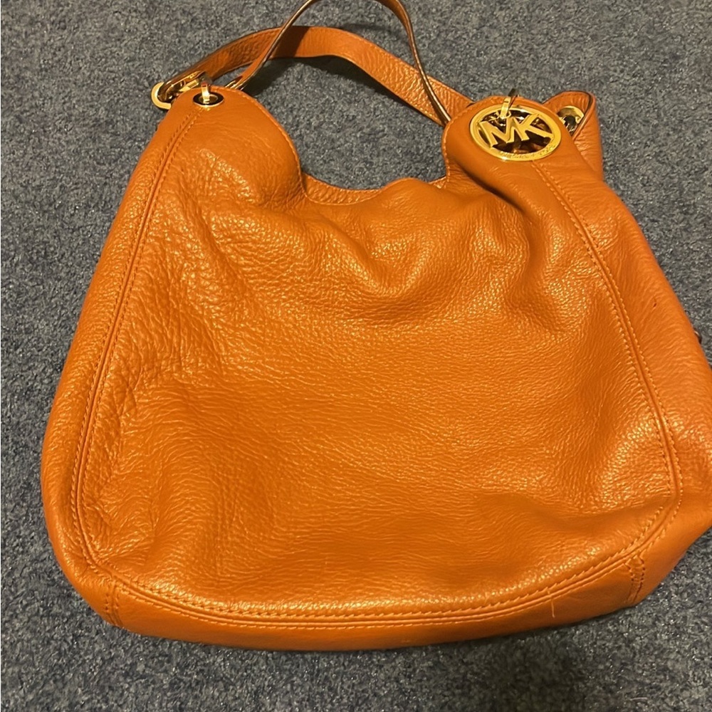 Michael Kors leather bag
3 compartment 
Gold hardware